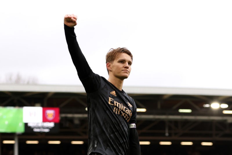 LONDON, ENGLAND - MARCH 12: Martin Odegaard of Arsenal celebrates victory in front of their fans after the Premier League match between Fulham FC and Arsenal FC at Craven Cottage on March 12, 2023 in London, England. (Photo by Ryan Pierse/Getty Images)