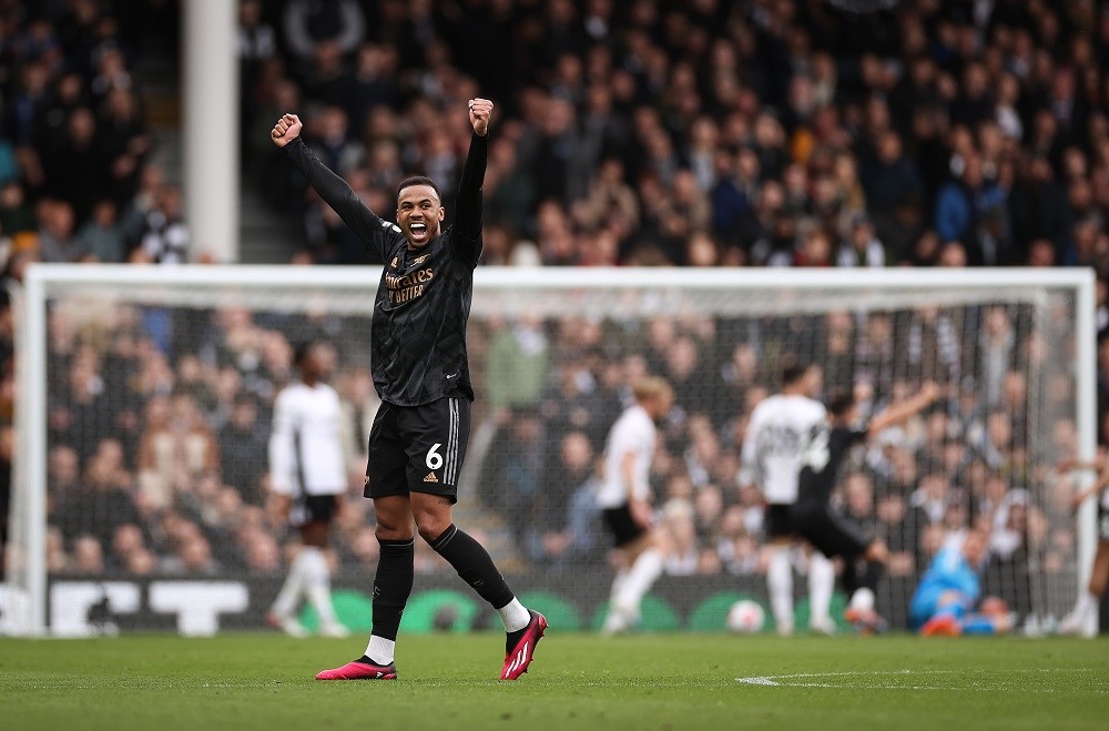 LONDON, ENGLAND: Gabriel Magalhaes of Arsenal celebrates after Gabriel Martinelli of Arsenal scores the team's second goal during the Premier League match between Fulham FC and Arsenal FC at Craven Cottage on March 12, 2023. (Photo by Ryan Pierse/Getty Images)