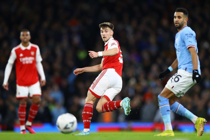 MANCHESTER, ENGLAND - JANUARY 27: Kieran Tierney of Arsenal passes as Riyad Mahrez of Manchester City looks on during the Emirates FA Cup Fourth Round match between Manchester City and Arsenal at Etihad Stadium on January 27, 2023 in Manchester, England. (Photo by Michael Steele/Getty Images)