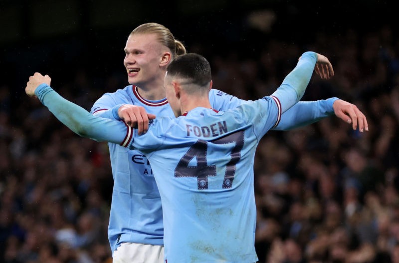 MANCHESTER, ENGLAND - MARCH 18: Erling Haaland of Manchester City celebrates with teammate Phil Foden after scoring the team's first goal during the Emirates FA Cup Quarter Final match between Manchester City and Burnley at Etihad Stadium on March 18, 2023 in Manchester, England. (Photo by Clive Brunskill/Getty Images)