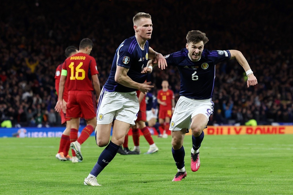 GLASGOW, SCOTLAND: Scott McTominay of Scotland celebrates with Kieran Tierney after scoring the team's second goal during the UEFA EURO 2024 qualifying round group A match between Scotland and Spain at Hampden Park on March 28, 2023. (Photo by Ian MacNicol/Getty Images)