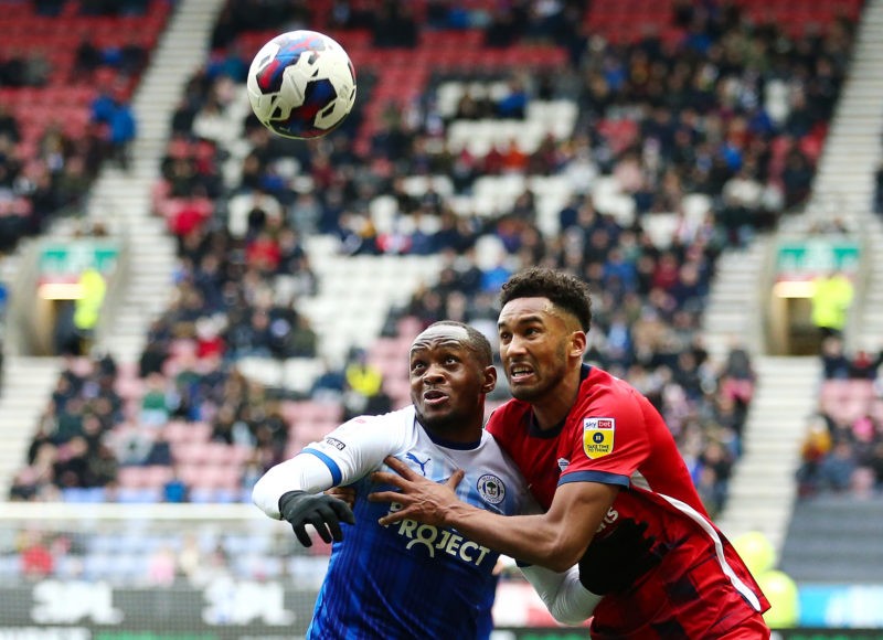 WIGAN, ENGLAND - MARCH 04: Ryan Nyambe of Wigan Athletic battles for possession with Auston Trusty of Birmingham City during the Sky Bet Championship between Wigan Athletic and Birmingham City at DW Stadium on March 04, 2023 in Wigan, England. (Photo by Matt McNulty/Getty Images)