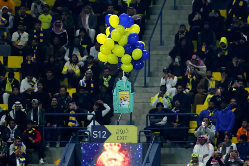 RIYADH, SAUDI ARABIA - JANUARY 22: Fans of Al Nassr release shirts attached to balloons, featuring a banner which reads 'Come Back Stronger, We Are Waiting For You' as a tribute in support of injured goalkeeper David Ospina, during the Saudi Pro League match between Al Nassr and Al-Ittifaq Club at Mrsool Park Stadium on January 22, 2023 in Riyadh, Saudi Arabia. (Photo by Yasser Bakhsh/Getty Images)