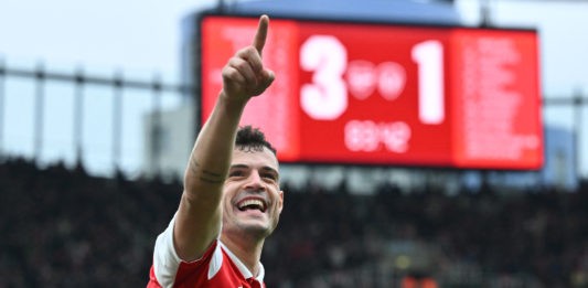 Arsenal's Swiss midfielder Granit Xhaka celebrates after scoring their fourth goal during the English Premier League football match between Arsenal and Leeds United at the Emirates Stadium in London on April 1, 2023. (Photo by GLYN KIRK/AFP via Getty Images)