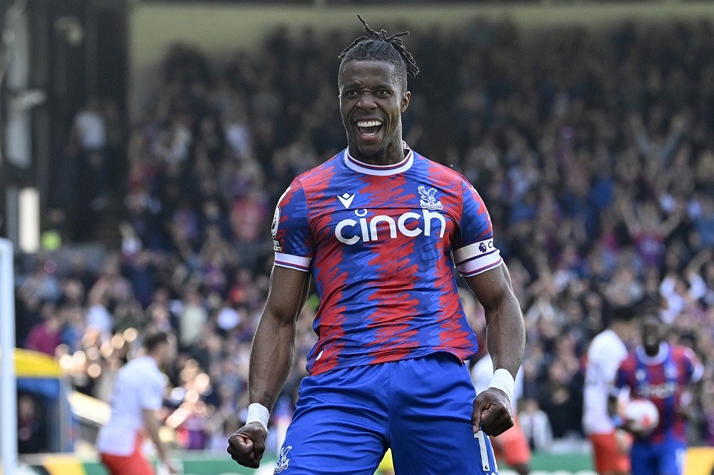 Crystal Palace's Ivorian striker Wilfried Zaha celebrates after scoring their second goal during the English Premier League football match between Crystal Palace and West Ham United at Selhurst Park in south London on April 29, 2023. (Photo by JUSTIN TALLIS/AFP via Getty Images)