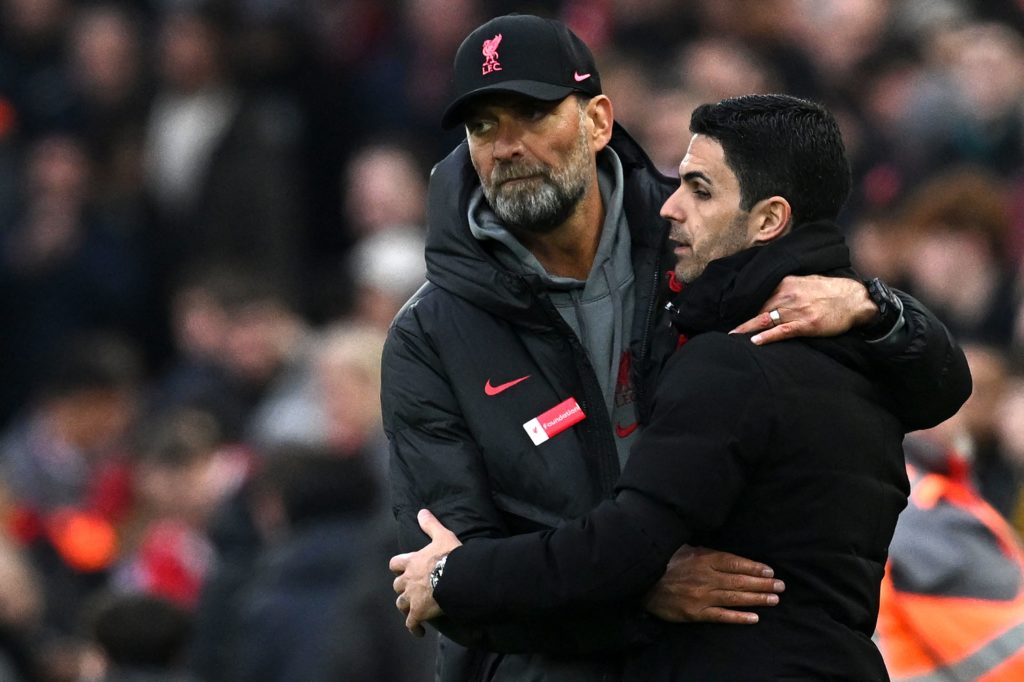 Liverpool's German manager Jurgen Klopp (L) embraces Arsenal's Spanish manager Mikel Arteta after the English Premier League football match between Liverpool and Arsenal at Anfield in Liverpool, north west England on April 9, 2023. - The match ended 2-2. (Photo by PAUL ELLIS/AFP via Getty Images)