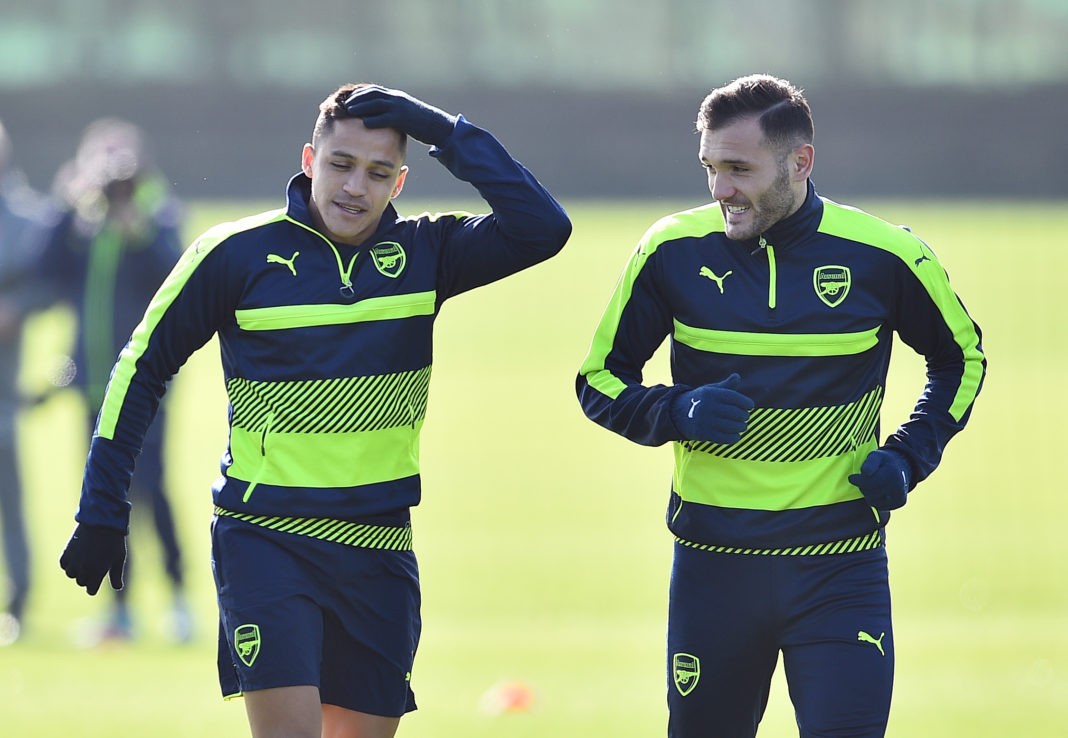 Arsenal's Chilean striker Alexis Sanchez (L) and Arsenal's Spanish striker Lucas Perez are seen during a training session ahead of their UEFA Champions League round of 16 second leg football match against Bayern Munich at Arsenal's London Colney training ground on March 6, 2017. (Photo credit GLYN KIRK/AFP via Getty Images)