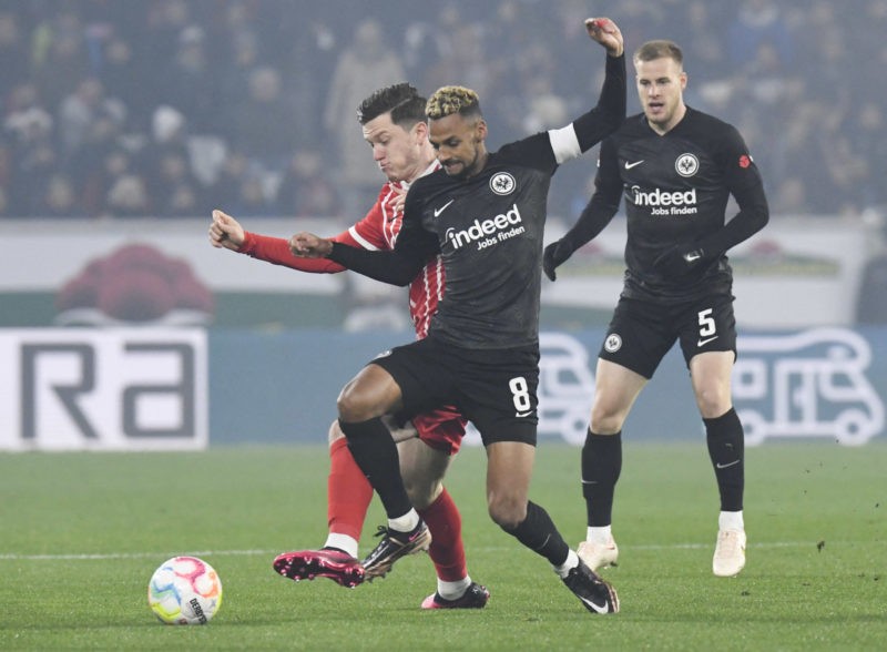 Freiburg's Austrian forward Michael Gregoritsch (L) and Frankfurt's Swiss midfielder Djibril Sow (C) vie for the ball during the German first division Bundesliga football match between SC Freiburg and Eintracht Frankfurt in Freiburg on January 25, 2023. - DFL REGULATIONS PROHIBIT ANY USE OF PHOTOGRAPHS AS IMAGE SEQUENCES AND/OR QUASI-VIDEO (Photo by Thomas KIENZLE / AFP) / DFL REGULATIONS PROHIBIT ANY USE OF PHOTOGRAPHS AS IMAGE SEQUENCES AND/OR QUASI-VIDEO (Photo by THOMAS KIENZLE/AFP via Getty Images)