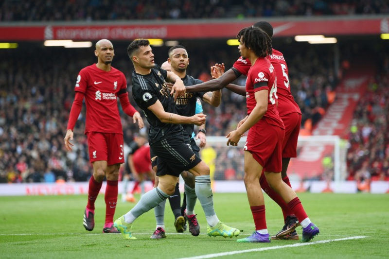 LIVERPOOL, ENGLAND - APRIL 09: Granit Xhaka of Arsenal is confronted by Trent Alexander-Arnold and Ibrahima Konate of Liverpool during the Premier League match between Liverpool FC and Arsenal FC at Anfield on April 09, 2023 in Liverpool, England. (Photo by Shaun Botterill/Getty Images)