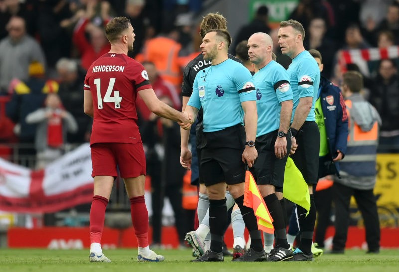 LIVERPOOL, ENGLAND - APRIL 09: Jordan Henderson of Liverpool shakes hands with Assistant Referee Constantine Hatzidakis after the Premier League match between Liverpool FC and Arsenal FC at Anfield on April 09, 2023 in Liverpool, England. (Photo by Shaun Botterill/Getty Images)
