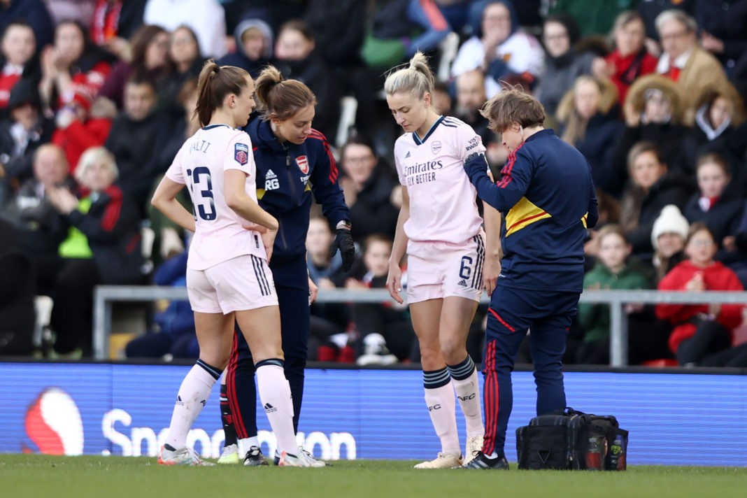 LEIGH, ENGLAND - APRIL 19: Leah Williamson of Arsenal receives medical treatment during the FA Women's Super League match between Manchester United and Arsenal at Leigh Sports Village on April 19, 2023 in Leigh, England. (Photo by Naomi Baker/Getty Images )