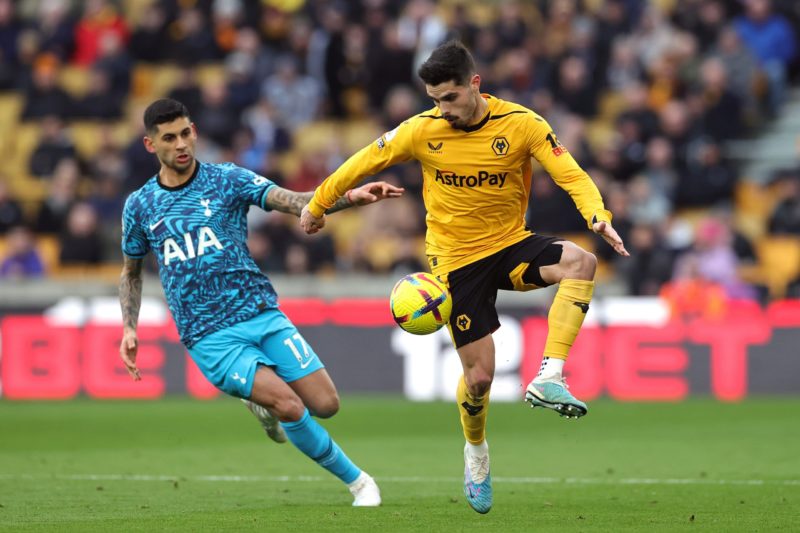 WOLVERHAMPTON, ENGLAND - MARCH 04: Cristian Romero of Tottenham Hotspur and Pedro Neto of Wolverhampton Wanderers battle for the ball during the Premier League match between Wolverhampton Wanderers and Tottenham Hotspur at Molineux on March 04, 2023 in Wolverhampton, England. (Photo by David Rogers/Getty Images)