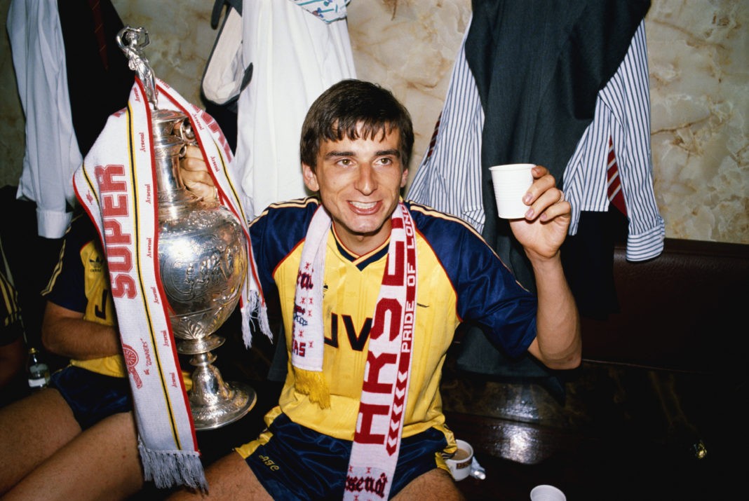 LIVERPOOL, UNITED KINGDOM - MAY 26: Arsenal goalscorer Alan Smith celebrates in the dressing room with the League Division One trophy after Arsenal had beaten Liverpool 2-0 in the final game of the season to pip Liverpool to the title, at Anfield on May 26, 1989 in Liverpool, England. (Photo by Allsport/Getty Images)