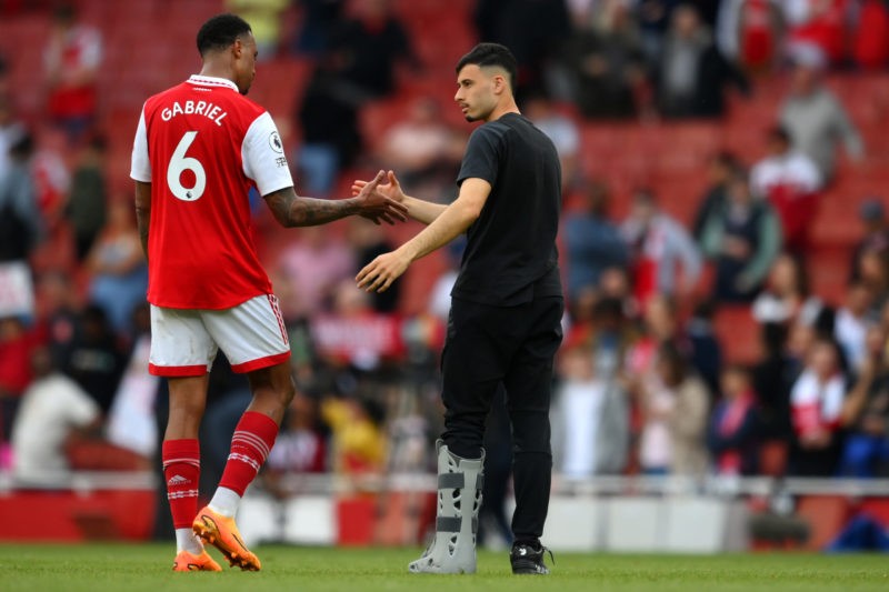 LONDON, ENGLAND - MAY 14: Gabriel of Arsenal is consoled by Gabriel Martinelli as they wear a foot brace after picking up an injury in the Premier League match between Arsenal FC and Brighton & Hove Albion at Emirates Stadium on May 14, 2023 in London, England. (Photo by Shaun Botterill/Getty Images)
