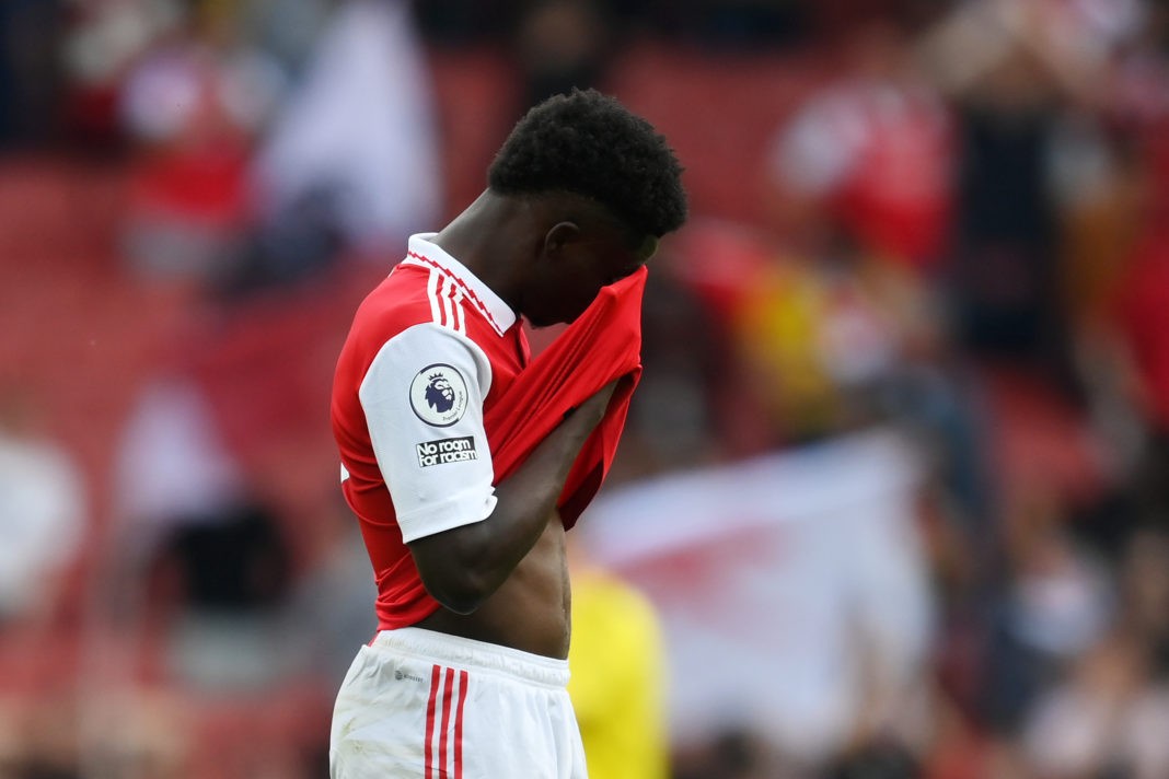LONDON, ENGLAND - MAY 14: Bukayo Saka of Arsenal looks dejected following the team's defeat during the Premier League match between Arsenal FC and Brighton & Hove Albion at Emirates Stadium on May 14, 2023 in London, England. (Photo by Shaun Botterill/Getty Images)