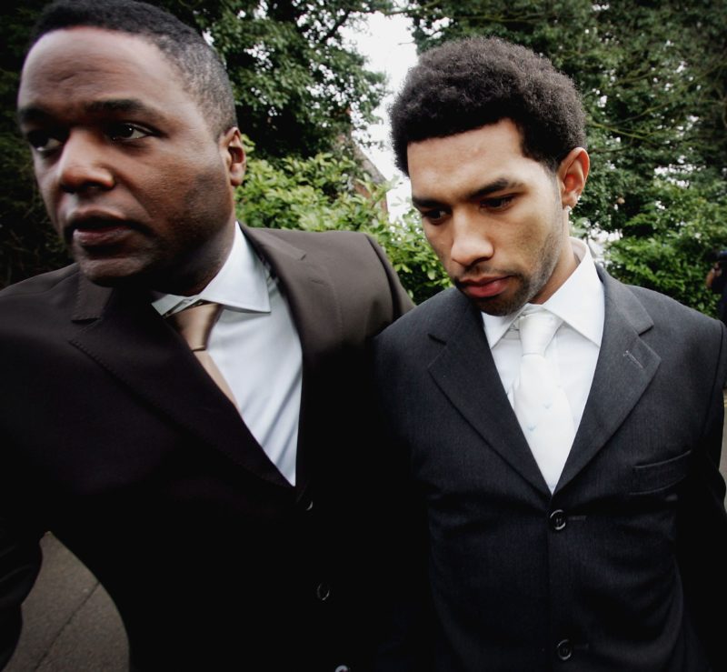 AYLESBURY, ENGLAND - MARCH 1: Footballer Jermaine Pennant (R) arrives with body gaurd at Aylesbury Magistrates Court on March 1, 2005 in Buckinghamshire, England. The Arsenal footballer currently on loan to Birmingham City is facing charges of drink driving while already banned from driving following a drinking offence from February last year. (Photo by Graeme Robertson/Getty Images)