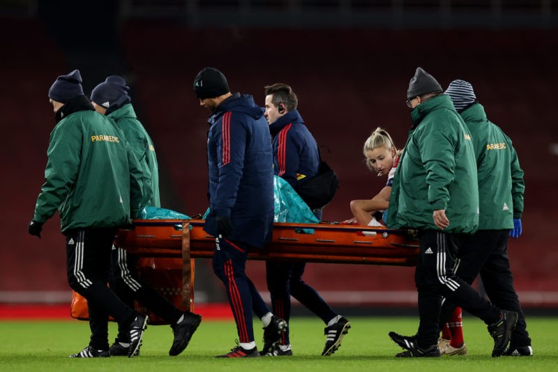 LONDON, ENGLAND - DECEMBER 15: Vivianne Miedema of Arsenal is stretchered off after picking up a serious leg injury during the UEFA Women's Champions League group C match between Arsenal  and Olympique Lyon at Emirates Stadium on December 15, 2022 in London, England. (Photo by Ryan Pierse/Getty Images)
