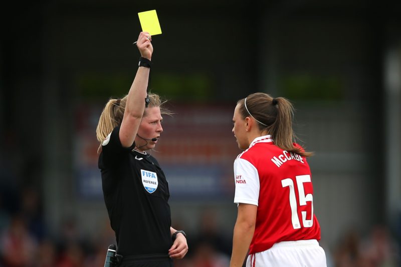 KINGSTON UPON THAMES, ENGLAND - MAY 21: Match Referee Abigail Bryne shows a yellow card to Katie McCabe of Arsenal during the FA Women's Super League match between Chelsea and Arsenal at Kingsmeadow on May 21, 2023 in Kingston upon Thames, England. (Photo by Steve Bardens/Getty Images)