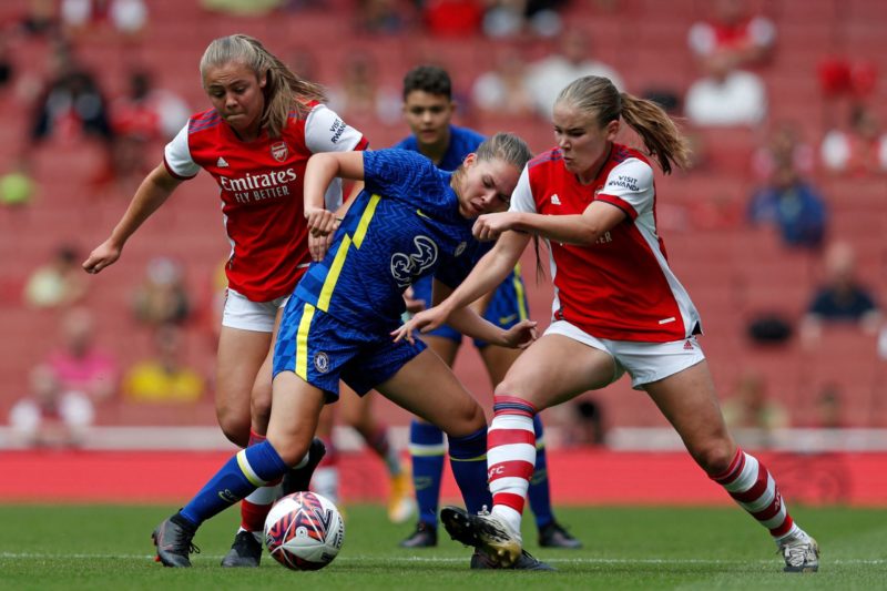 Chelsea's English midfielder Grace Palmer (C) vies with Arsenal's Freya Godfrey (R) during the pre-season friendly women's football match between Arsenal and Chelsea at The Emirates Stadium in north London on August 1, 2021. (Photo by Adrian DENNIS / AFP) (Photo by ADRIAN DENNIS/AFP via Getty Images)