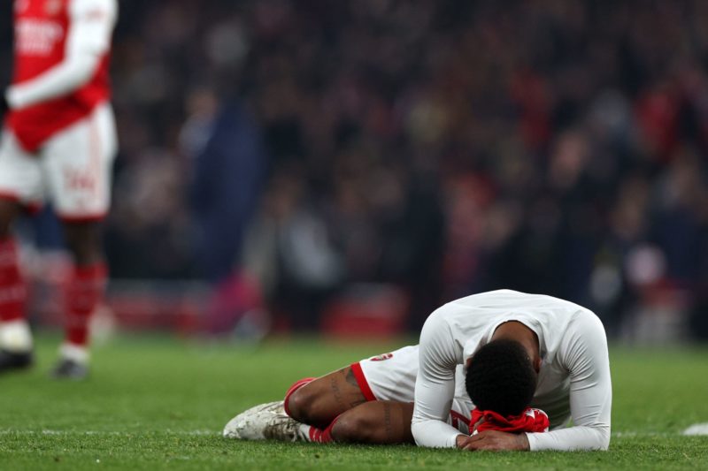 Arsenal's English midfielder Reiss Nelson reacts on the pitch after the English Premier League football match between Arsenal and Southampton at the Emirates Stadium in London on April 21, 2023. - The game finished 3-3. (Photo by ADRIAN DENNIS/AFP via Getty Images)