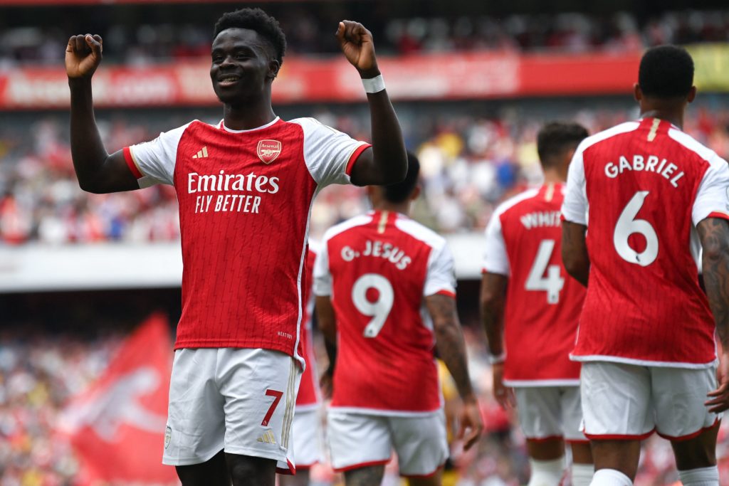 Arsenal news, gossip, transfers - Arsenal's English midfielder Bukayo Saka celebrates after scoring his team's third goal during the English Premier League football match between Arsenal and Wolverhampton Wanderers at the Emirates Stadium in London on May 28, 2023. (Photo by GLYN KIRK/AFP via Getty Images)