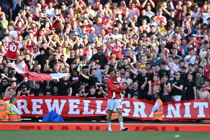 Arsenal supporters hold a "Farewell Granit" banner as Arsenal's Swiss midfielder Granit Xhaka walks off the pitch at the end of the English Premier League football match between Arsenal and Wolverhampton Wanderers at the Emirates Stadium in London on May 28, 2023. (Photo by GLYN KIRK/AFP via Getty Images)