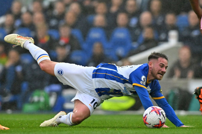 Brighton's Argentinian midfielder Alexis Mac Allister falls during the English Premier League football match between Brighton and Hove Albion and Everton at the American Express Community Stadium in Brighton, southern England on May 8, 2023. (Photo by GLYN KIRK/AFP via Getty Images)
