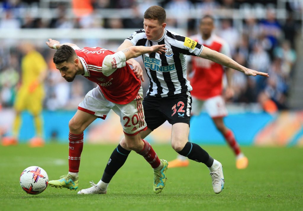 Arsenal's Italian midfielder Jorginho (L) fights for the ball with Newcastle United's English midfielder Elliot Anderson (R) during the English Premier League football match between Newcastle United and Arsenal at St James' Park in Newcastle-upon-Tyne, north east England on May 7, 2023. (Photo by LINDSEY PARNABY/AFP via Getty Images)