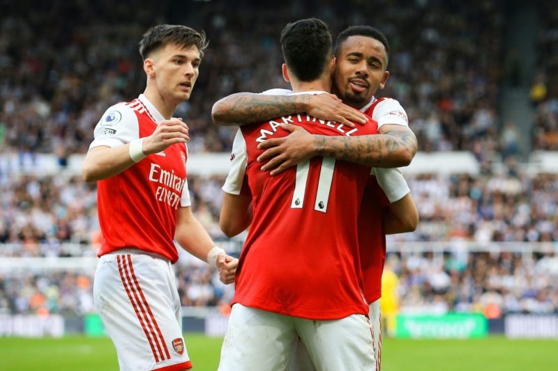 Arsenal's Brazilian midfielder Gabriel Martinelli (C) is congratulated by Arsenal's Brazilian striker Gabriel Jesus (R) after celebrates scoring his team's second goal during the English Premier League football match between Newcastle United and Arsenal at St James' Park in Newcastle-upon-Tyne, north east England on May 7, 2023.(Photo by LINDSEY PARNABY/AFP via Getty Images)