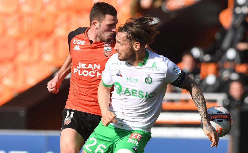 Lorient's French midfielder Quentin Boisgard (L) vies for the ball with Saint-Etienne's French defender Mathieu Debuchy during the French L1 football match between FC Lorient and AS Saint-Etienne, at the Moustoir stadium in Lorient, north-western France, on February 28, 2021. (Photo by Fred TANNEAU / AFP) (Photo by FRED TANNEAU/AFP via Getty Images)