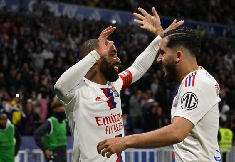 Lyon's French forward Alexandre Lacazette (L) celebrates after scoring during the French L1 football match between Olympique Lyonnais (OL) and AS Monaco at The Groupama Stadium in Decines-Charpieu, central-eastern France on May 19, 2023. (Photo by JEAN-PHILIPPE KSIAZEK/AFP via Getty Images)