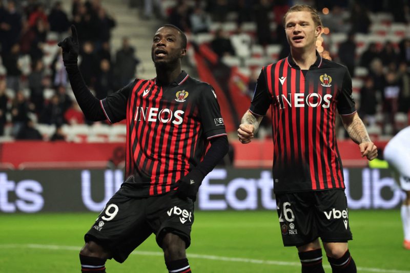 Nice's Ivorian forward Nicolas Pepe (L) celebrates with Nice's French defender Melvin Bard after scoring his team's third goal during the French L1 football match between OGC Nice and Montpellier Herault SC at the Allianz Riviera Stadium in Nice, south-eastern France, on January 11, 2023. (Photo by VALERY HACHE/AFP via Getty Images)