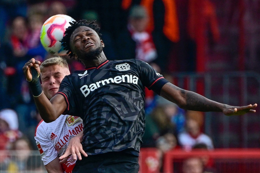 Leverkusen's Burkinabe defender Edmond Tapsoba and Union Berlin's Hungarian midfielder Andras Schaefer both jump to head the ball during the German first division Bundesliga football match between Union Berlin and Bayer 04 Leverkusen in Berlin on April 29, 2023. (Photo by John MACDOUGALL / AFP) / DFL REGULATIONS PROHIBIT ANY USE OF PHOTOGRAPHS AS IMAGE SEQUENCES AND/OR QUASI-VIDEO ALTERNATIVE CROP (Photo by JOHN MACDOUGALL/AFP via Getty Images)