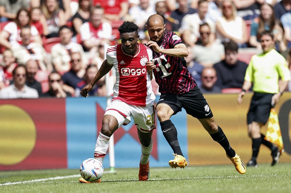 Ajax's Mohammed Kudus (L) fights for the ball with Utrecht's Mark van der Maarel during the Dutch Eredivisie football match between Ajax Amsterdam and FC Utrecht at the Johan Cruijff ArenA in Amsterdam, on May 21, 2023. (Photo by MAURICE VAN STEEN/ANP/AFP via Getty Images)
