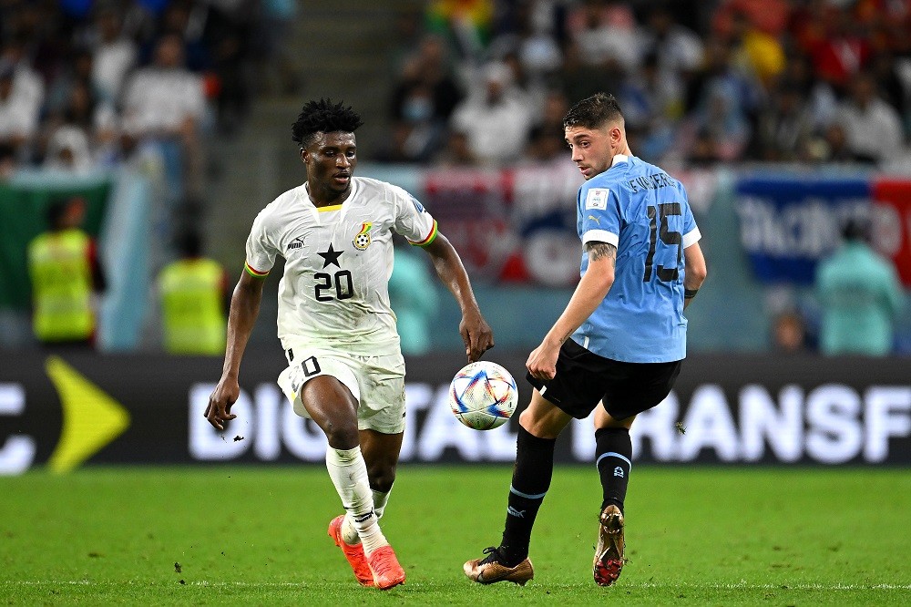 AL WAKRAH, QATAR: Mohammed Kudus of Ghana takes on Federico Valverde of Uruguay during the FIFA World Cup Qatar 2022 Group H match between Ghana and Uruguay at Al Janoub Stadium on December 02, 2022. (Photo by Clive Mason/Getty Images)
