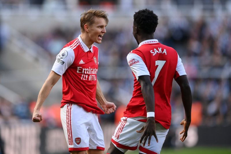 NEWCASTLE UPON TYNE, ENGLAND - MAY 07: Martin Odegaard of Arsenal celebrates after scoring the team's first goal with teammate Bukayo Saka during the Premier League match between Newcastle United and Arsenal FC at St. James Park on May 07, 2023 in Newcastle upon Tyne, England. (Photo by Stu Forster/Getty Images)