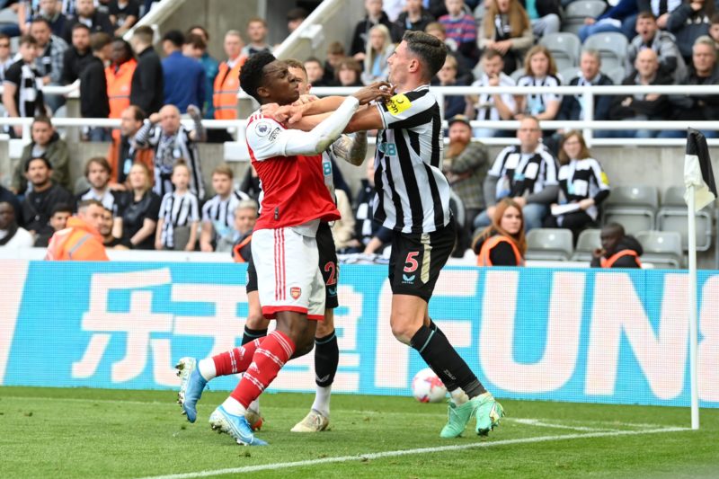 NEWCASTLE UPON TYNE, ENGLAND - MAY 07: Eddie Nketiah of Arsenal and Fabian Schaer of Newcastle United clash during the Premier League match between Newcastle United and Arsenal FC at St. James Park on May 07, 2023 in Newcastle upon Tyne, England. (Photo by Michael Regan/Getty Images)