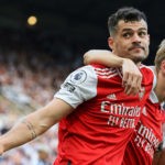 TOPSHOT - Arsenal's Swiss midfielder Granit Xhaka and Arsenal's Norwegian midfielder Martin Odegaard (R) celebrates their team's second goal during the English Premier League football match between Newcastle United and Arsenal at St James' Park in Newcastle-upon-Tyne, north east England on May 7, 2023. (Photo by LINDSEY PARNABY/AFP via Getty Images)