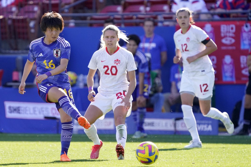 FRISCO, TEXAS - FEBRUARY 22: Honoka Hayashi #16 of Japan kicks the ball in front of Cloé Lacasse #20 of Canada during the second half of a 2023 SheBelieves Cup match at Toyota Stadium on February 22, 2023 in Frisco, Texas. (Photo by Sam Hodde/Getty Images)