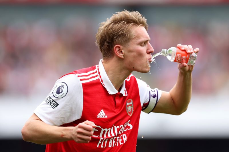 LONDON, ENGLAND - MAY 14: Martin Odegaard of Arsenal drinks a bottle of water prior to the Premier League match between Arsenal FC and Brighton & Hove Albion at Emirates Stadium on May 14, 2023 in London, England. (Photo by Julian Finney/Getty Images)