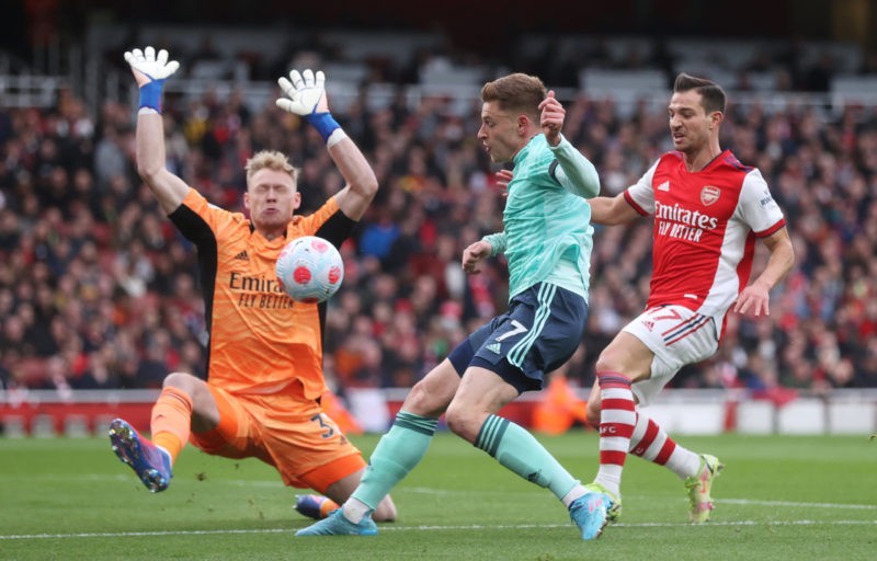 LONDON, ENGLAND - MARCH 13: Aaron Ramsdale of Arsenal makes a save from Harvey Barnes of Leicester City during the Premier League match between Arsenal and Leicester City at Emirates Stadium on March 13, 2022 in London, England. (Photo by Alex Pantling/Getty Images)