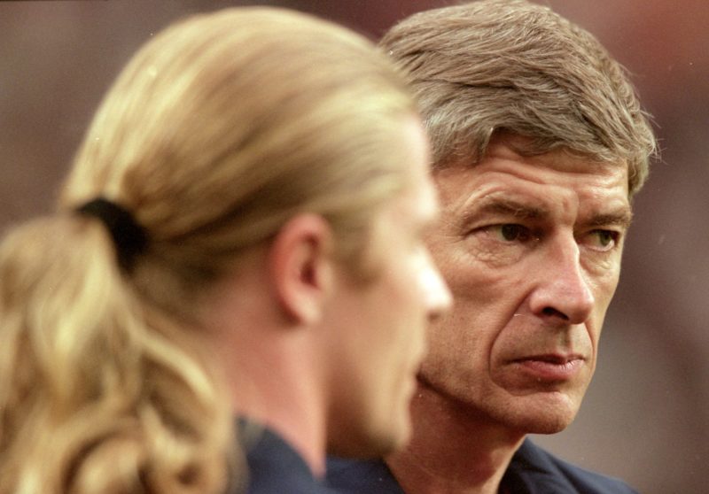 3 Aug 2000: Arsenal Manager Arsene Wenger chats to former Arsenal player Emmanuel Petit of Barcelona who was making his debut during the Pre-Season Friendly Tournament match at the Amsterdam ArenA, in Amsterdam, Holland. Barcelona won the match 2-1. Credit: Shaun Botterill /Allsport
