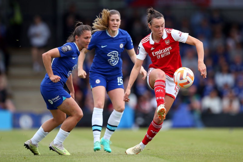 KINGSTON UPON THAMES, ENGLAND - MAY 21: Caitlin Foord of Arsenal passes the ball whilst under pressure from Eve Perisset of Chelsea during the FA Women's Super League match between Chelsea and Arsenal at Kingsmeadow on May 21, 2023 in Kingston upon Thames, England. (Photo by Steve Bardens/Getty Images)