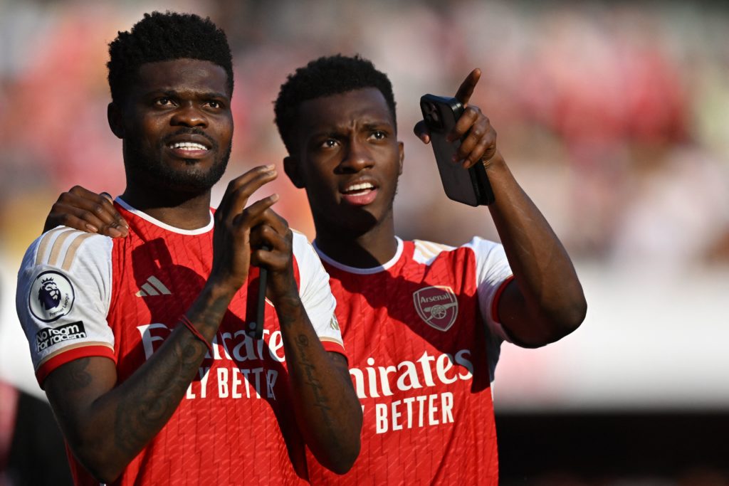 Arsenal's Ghanaian midfielder Thomas Partey speaks to Arsenal's English striker Eddie Nketiah (R) during the English Premier League football match between Arsenal and Wolverhampton Wanderers at the Emirates Stadium in London on May 28, 2023. (Photo by GLYN KIRK/AFP via Getty Images)
