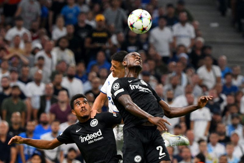 Marseille's Chilean forward Alexis Sanchez (C) jumps for the ball against Frankfurt's German forward Ansgar Knauff (L) and Frankfurt's French defender Evan N'Dicka (R) during the UEFA Champions League, Group D football match, between Olympique Marseille (OM) and Eintracht Frankfurt at Stade Velodrome in Marseille, southern France on September 13, 2022.(Photo by NICOLAS TUCAT/AFP via Getty Images)