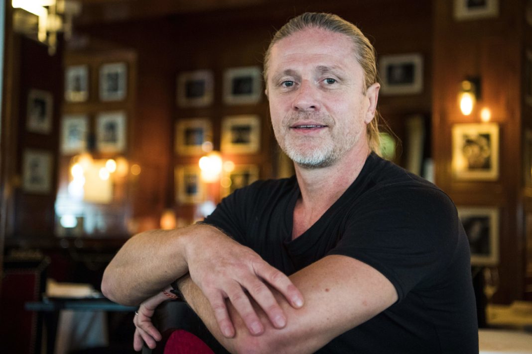 Former French midfielder and 1998 World Champion, Emmanuel Petit poses during a photo session on September 14, 2017 in Paris. Challenged Arsenal head coach Arsene Wenger 
