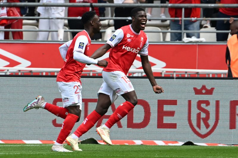 Folarin Balogun Arsenal exit - Reims' midfielder Marshall Munetsi and Reims' forward Folarin Balogun (L) celebrate after scoring a goal during the French L1 football match between Reims and Angers at Auguste Delaune stadium in Reims May 21, 2023. (Photo by DENIS CHARLET/AFP via Getty Images)