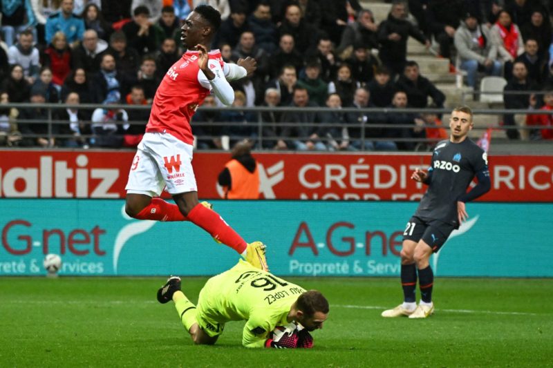 Folarin Balogun Arsenal exit -Reims' English forward Folarin Balogun (L) and Marseille's Spanish goalkeeper Pau Lopez (C) fight for the ball during the French L1 football match between Stade de Reims and Olympique Marseille (OM) at Stade Auguste-Delaune in Reims, northern France on March 19, 2023. (Photo by FRANCOIS LO PRESTI/AFP via Getty Images)