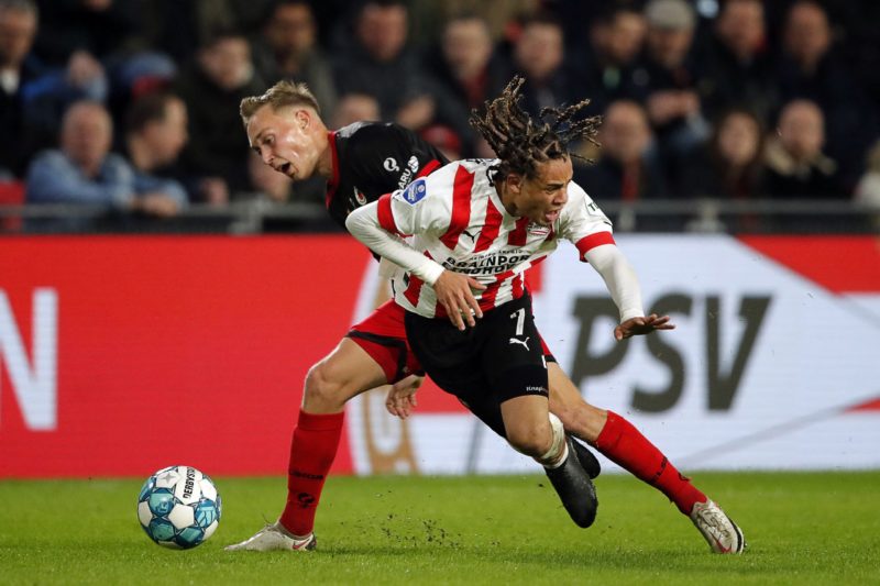 Excelsior's Dutch midfielder Julian Baas (L) fights for the ball with PSV's Dutch midfielder Xavi Simons during the Dutch Eredivisie football match between PSV Eindhoven and Excelsior Rotterdam at the Phillips Stadium in Eindhoven on April 8, 2023. (Photo by BART STOUTJESDIJK/ANP/AFP via Getty Images)