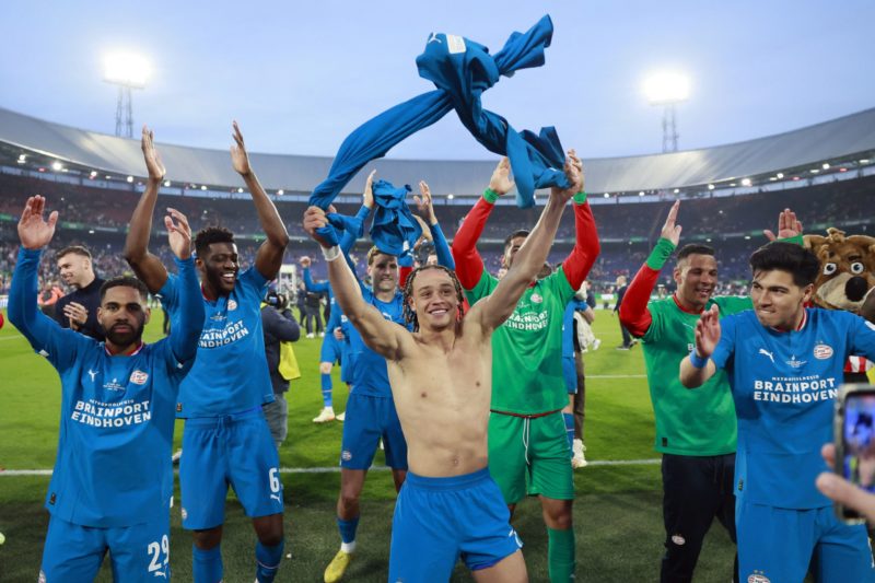 PSV's Dutch midfielder Xavi Simons of PSV Eindhoven (C) celebrates with teammates after winning the KNVB Cup final between PSV Eindhoven and Ajax Amsterdam at the Stadium de Kuip in Rotterdam on April 30, 2023. (Photo by ROBIN VAN LONKHUIJSEN/ANP/AFP via Getty Images)